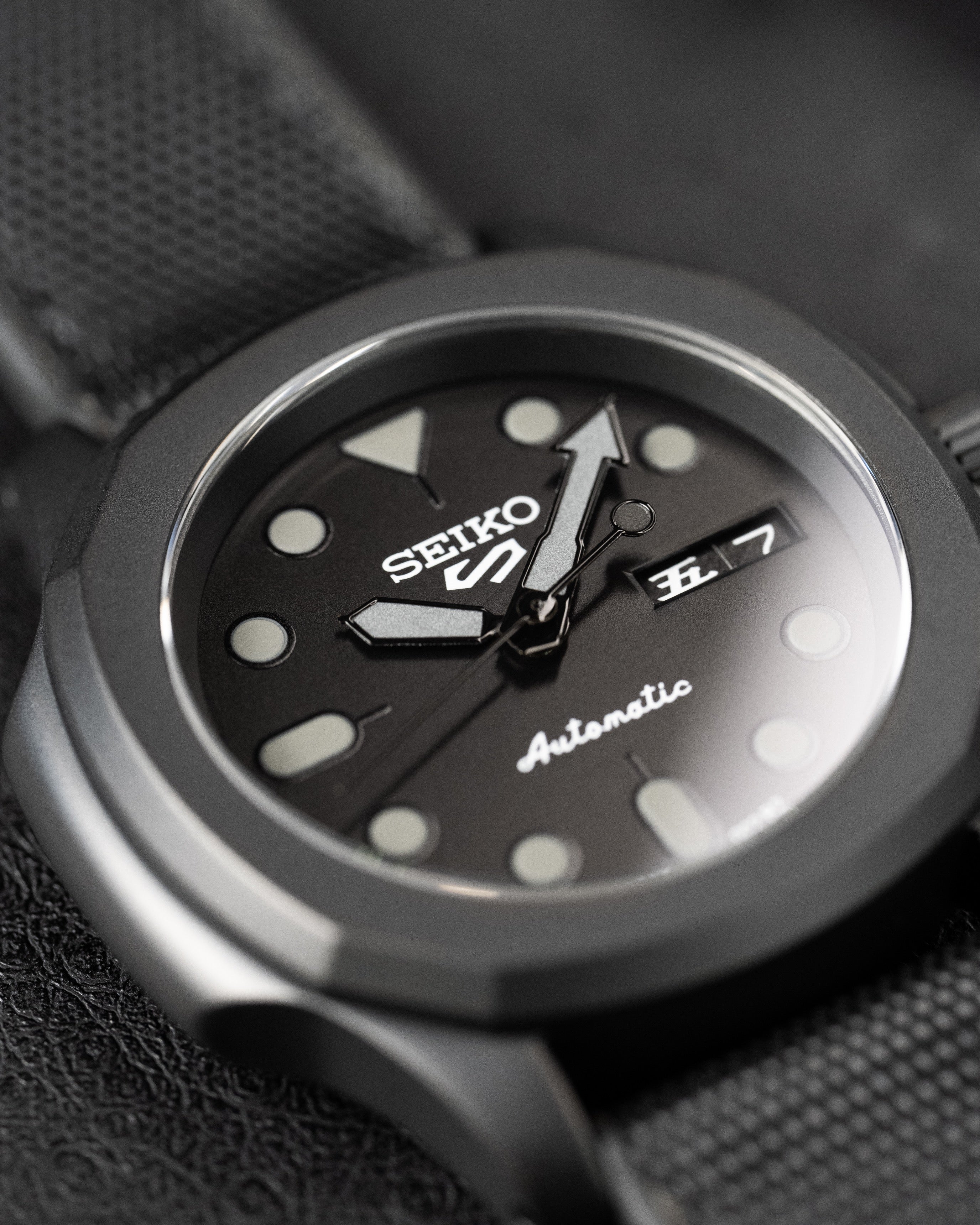 Custom Seiko 5 Mod Blackout – Watch With Matte Black Stealth Nautilus Case Black Dial With Bold Lume Markers Arrow Handset And Canvas Strap