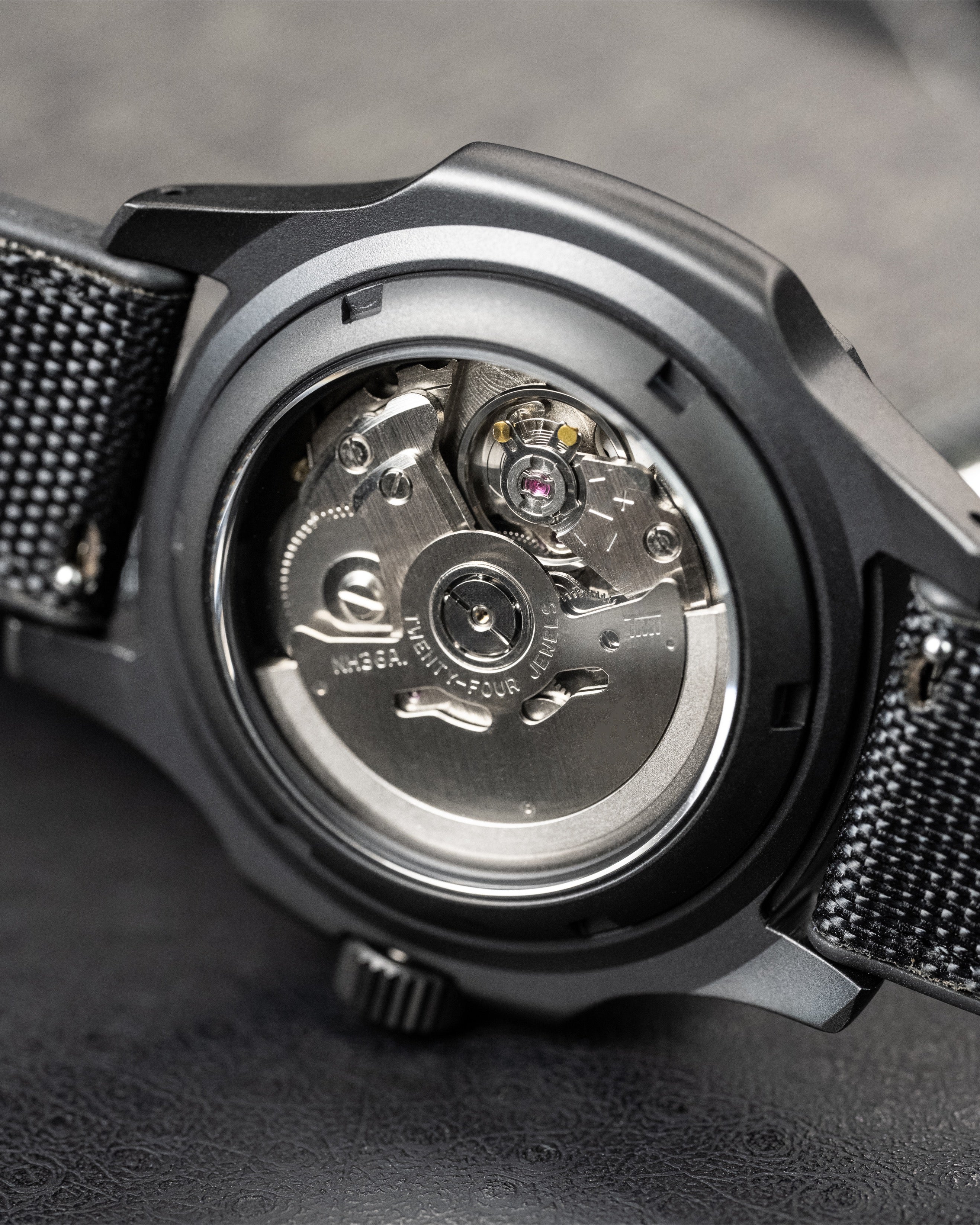 Custom Seiko 5 Mod Blackout – Watch With Matte Black Stealth Nautilus Case Black Dial With Bold Lume Markers Arrow Handset And Canvas Strap