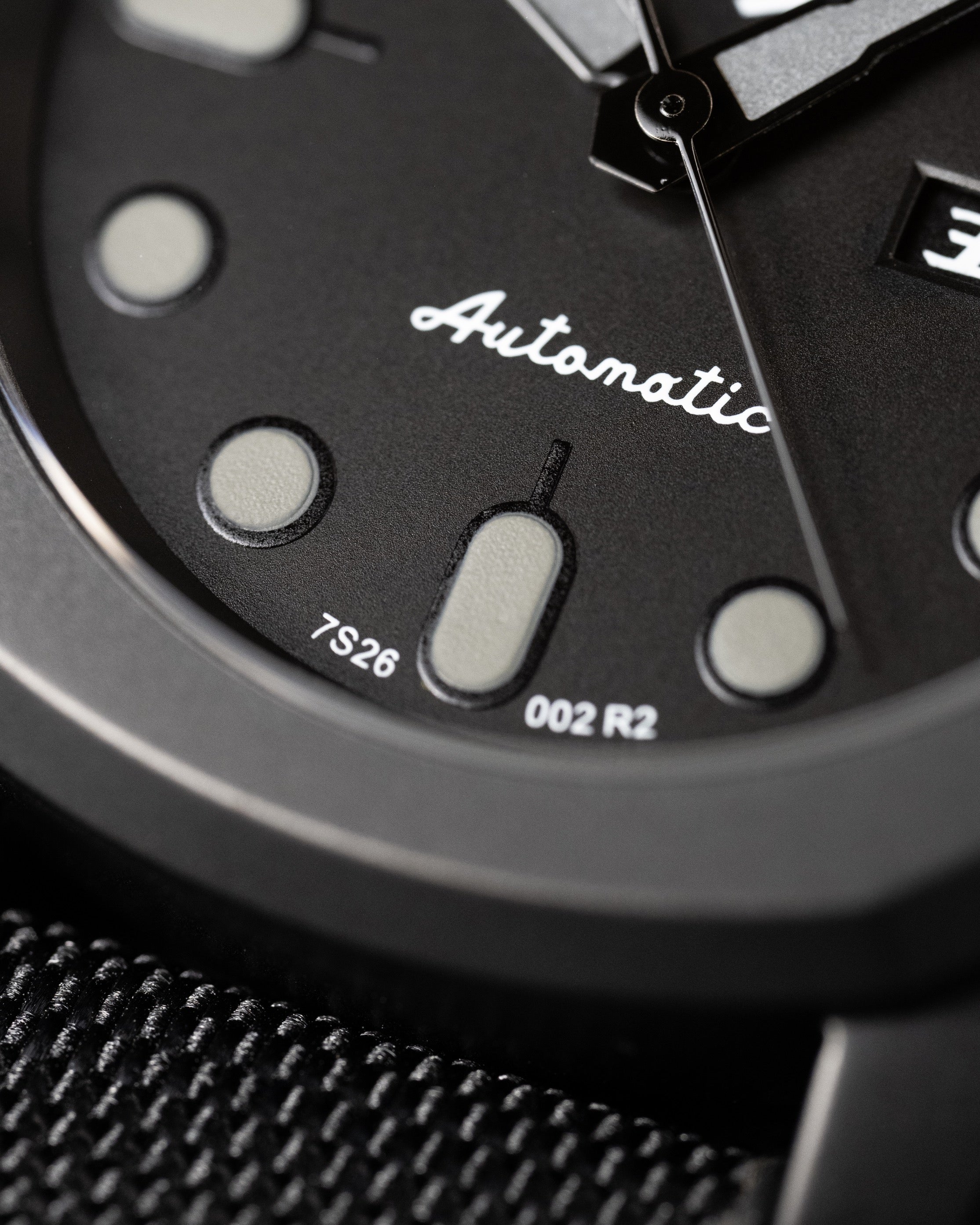 Custom Seiko 5 Mod Blackout – Watch With Matte Black Stealth Nautilus Case Black Dial With Bold Lume Markers Arrow Handset And Canvas Strap