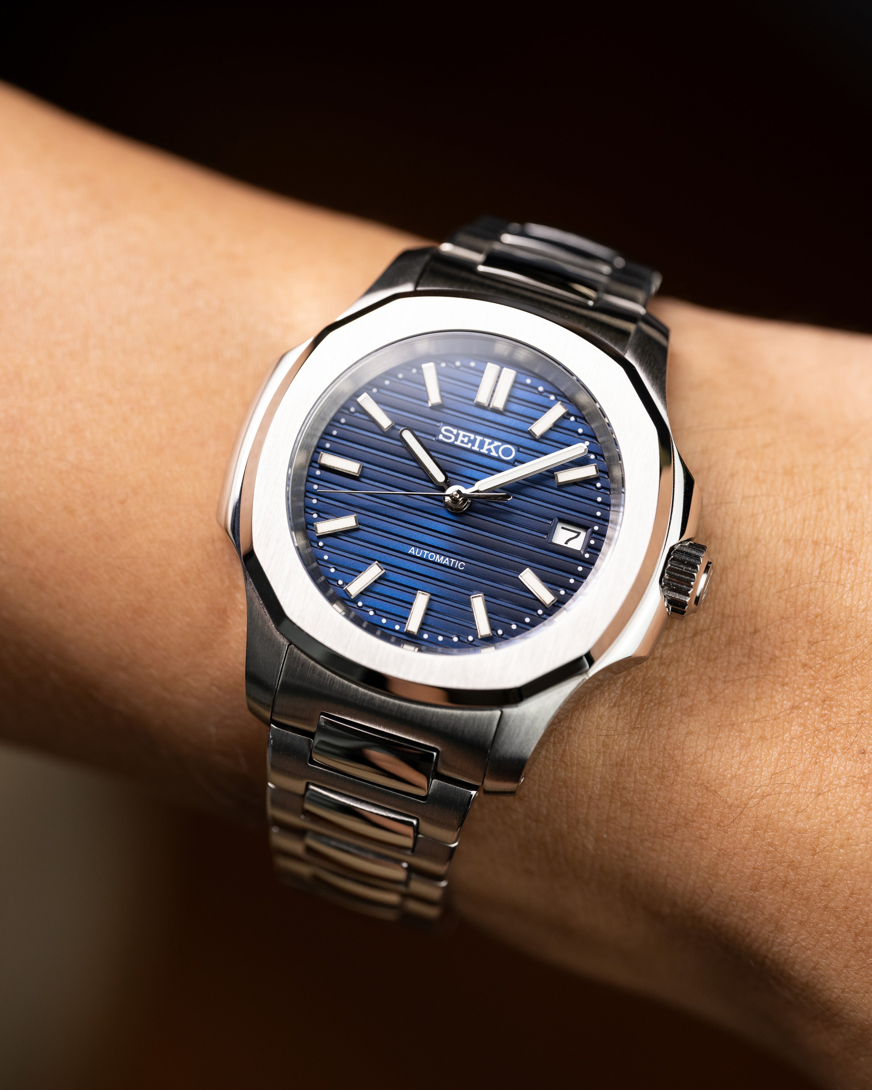 Custom Seiko Mod – With Nautilus Stainless Steel Case And Bracelet Textured Blue Dial Automatic Movement Date Display Worn On Hand1