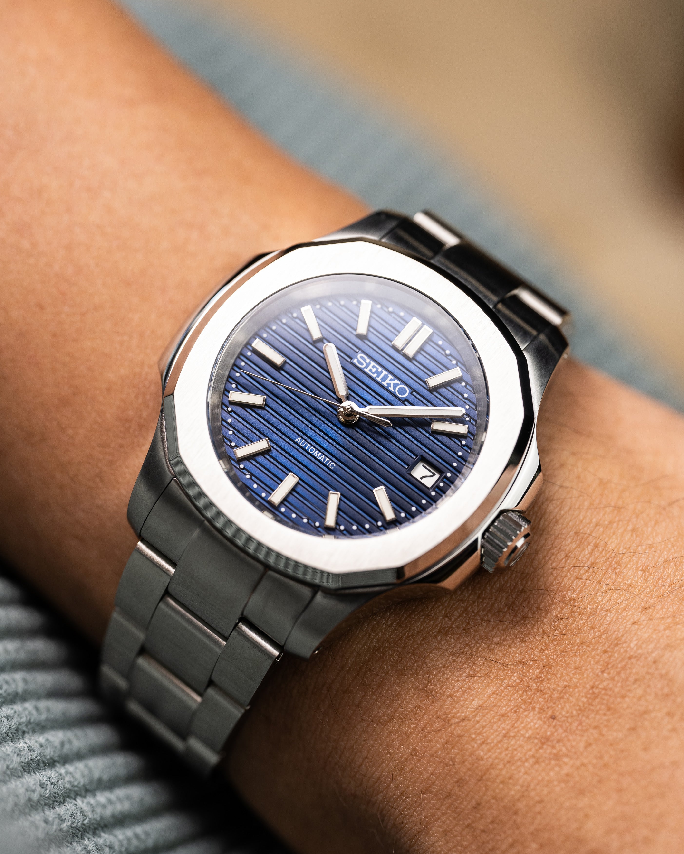 Custom Seiko Mod – With Nautilus Stainless Steel Case And Bracelet Textured Blue Dial Automatic Movement Date Display Worn On Hand