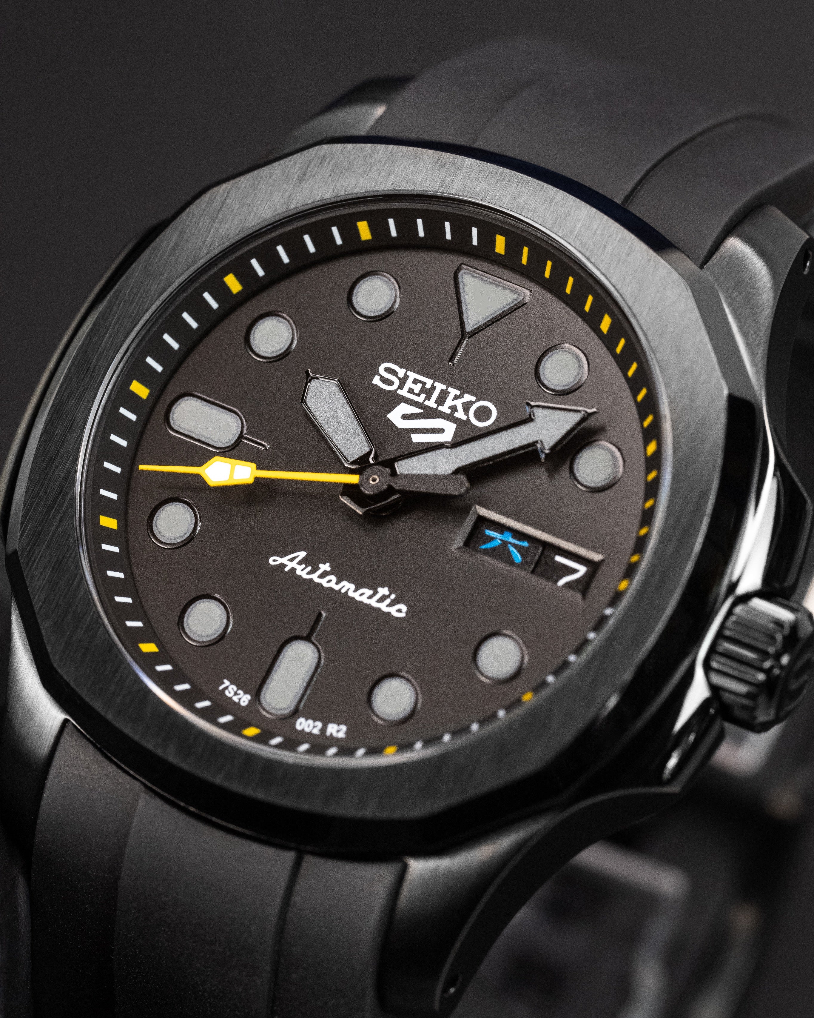 Custom Stealth Seiko 5 Mod – With Polished Black Nautilus Case Grey Indices Yellow Minute Track Yellow Second Hand And Black Rubber Strap