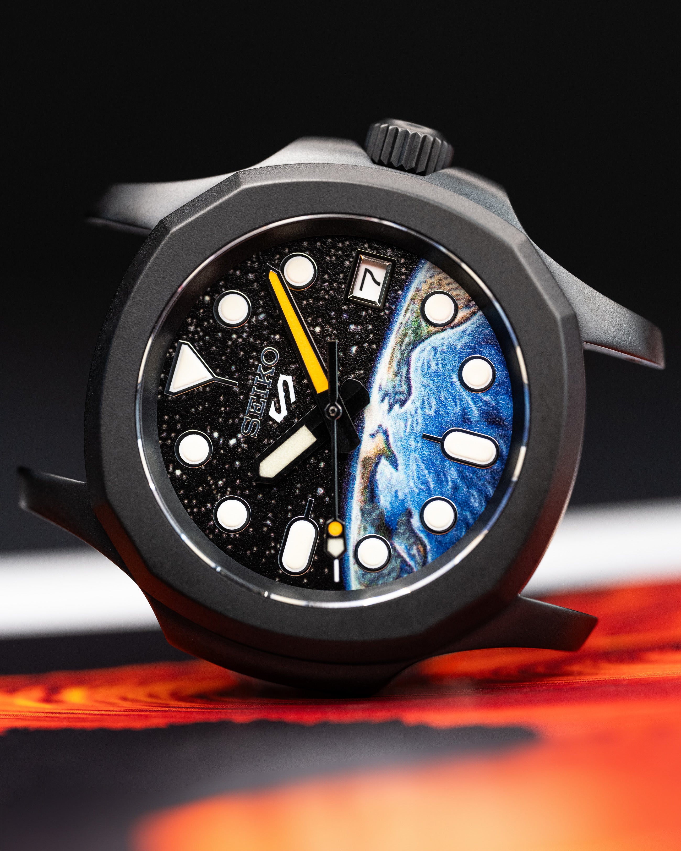 Custom Seiko 5 Mod Watch – Space Inspired Dial With Earth Artwork Matte Black Nautilus Case Orange-Accented Hands And Black Nato Strap